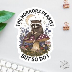 The Horrors Persist But So Do I Raccoon Sticker